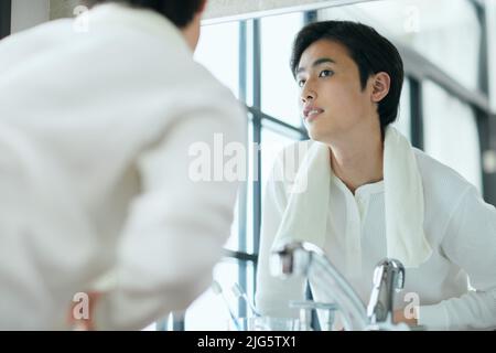 Japanese man doing skincare Stock Photo