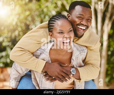 I meant it when I said I have your back. Shot of an affectionate couple spending time outdoors. Stock Photo