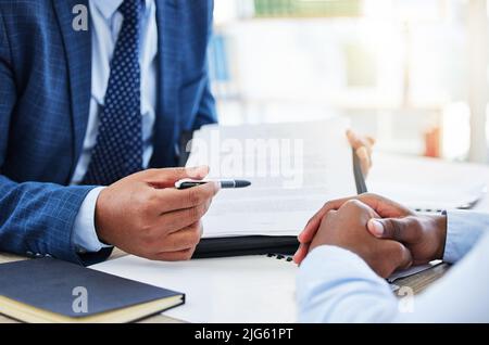 Dont worry about planning every step of your life. Shot of a unrecognizable businessman signing a contract in a office. Stock Photo