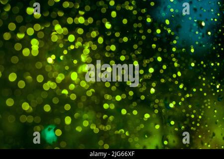 Mystical green highlights, abstract bokeh, night background. Stock Photo