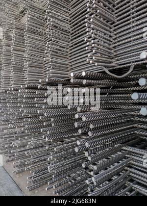 Reinforcing bars framework for armored concrete construction. Layers stacked and stowed for transport Stock Photo