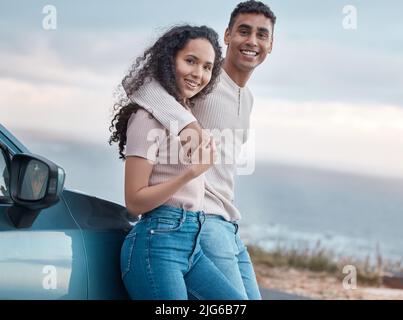 Drives to nowhere are peaceful. Shot of a young couple on a road trip together. Stock Photo