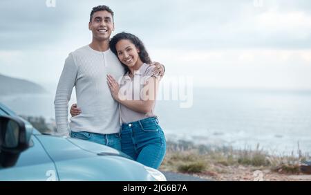 Nothing can get in between us. Shot of a young couple on a road trip together. Stock Photo