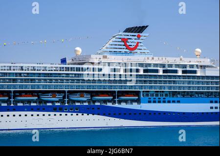 Corfu Town, Corfu, Greece - TUI cruise ship Marella Explorer is moored in the port of Corfu. The 262 meter long ship has a mass of 9,900 tons. Stock Photo