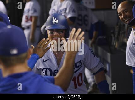 Los Angeles, United States. 08th July, 2022. Los Angeles Dodgers Justin Turner celebrates with teammates in the dugout after hitting a solo home run to center off Chicago Cubs starting pitcher Mark Leiter Jr. during the fourth inning at Dodger Stadium in Los Angeles on Thursday, July 7, 2022. The Dodgers beat the Cubs 5-3. Photo by Jim Ruymen/UPI Credit: UPI/Alamy Live News Stock Photo