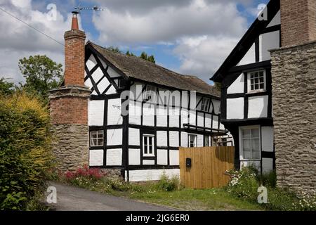 Medieval black and white half timbered houses in the mediaeval village of Pembridge in Arrow Valley Herefordhire UK Stock Photo