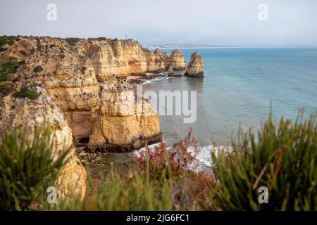 Rocky cliffs on portuguese coastline, located in Algarve, on the south of Portugal Stock Photo