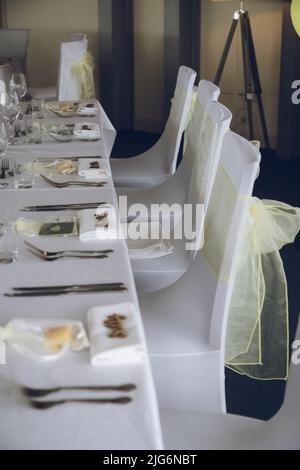 A wedding table laid out before a wedding breakfast Stock Photo