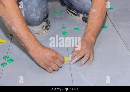 Bathroom tile leveling system with plastic clips and wedges Stock Photo
