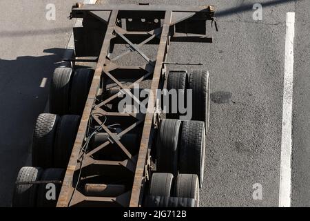 An empty cargo truck parked on an urban asphalt road, aerial view Stock Photo