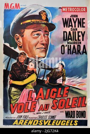 JOHN WAYNE as Frank Wead MAUREEN O'HARA and DAN DAILEY in THE WINGS OF EAGLES / L'AIGLE VOLE AU SOLEIL 1957 director JOHN FORD screenplay Frank Fenton and William Wister Haines based on the life and writings of Frank W. ''Spig'' Wead Metro Goldwyn Mayer Stock Photo