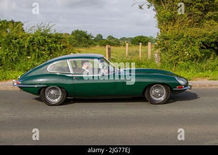 1967 60s sixties green British Jaguar 2+2 E-Type 4235cc petrol vintage sports car, en-route to Hoghton Tower for the Supercar Summer Showtime car meet which is organised by Great British Motor Shows in Preston, UK Stock Photo
