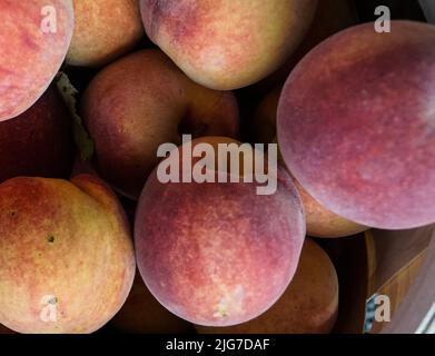 Close-up view of fresh ripe peaches. Stock Photo