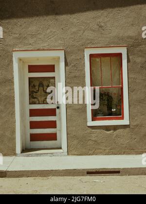 Door and window in a Spanish-American home, Costilla, New Mexico. Stock Photo