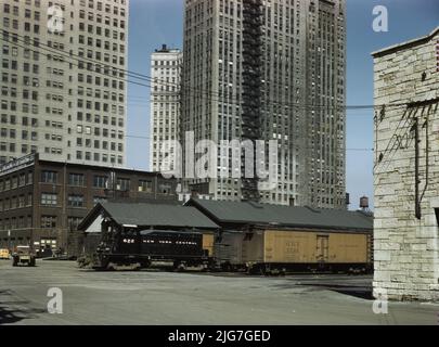 Diesel switch engine moving freight cars at the South Water street freight terminal of the Illinois Central R.R., Chicago, Ill. [Refrigerated wagon], Stock Photo