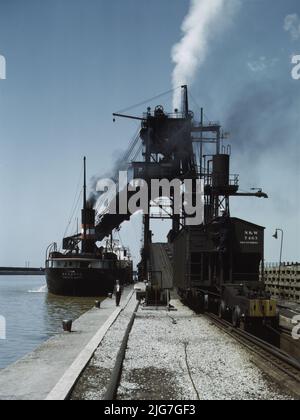 Loading a lake freighter with coal at the Pennsylvania R.R. coal docks, for shipment to other Great Lake ports, Sandusky, Ohio. Stock Photo