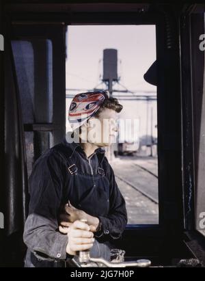 C. &amp; N.W. R.R. Cloe Weaver, mother of four children, employed as a helper at the roundhouse, Clinton, Iowa. She is learning to operate the turntable. Her husband works for a structural steel company. Stock Photo