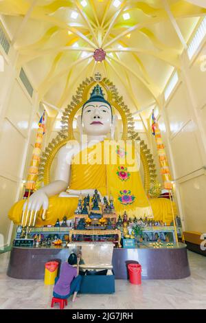 Giant Buddha in the Sakya Muni Buddha Gaya Temple, Republic of Singapore.  The temple is also known as the Temple of 1000 Lights Stock Photo