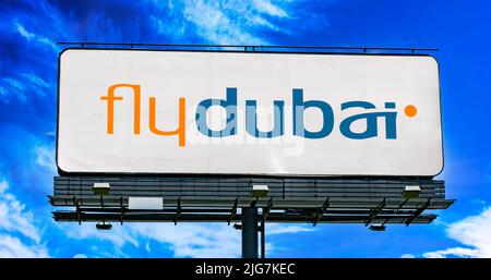 POZNAN, POL - JUN 23, 2022: Advertisement billboard displaying logo of Flydubai, an Emirati government-owned low-cost airline in Dubai, United Arab Em Stock Photo