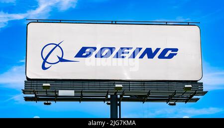 POZNAN, POL - JUN 28, 2022: Advertisement billboard displaying logo of The Boeing Company, an American multinational aerospace corporation Stock Photo