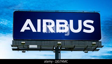 POZNAN, POL - JUN 28, 2022: Advertisement billboard displaying logo of Airbus, a European multinational aerospace corporation Stock Photo