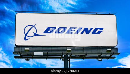 POZNAN, POL - JUN 28, 2022: Advertisement billboard displaying logo of The Boeing Company, an American multinational aerospace corporation Stock Photo