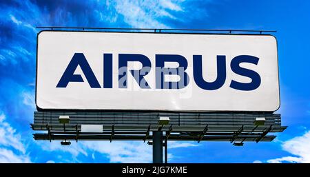 POZNAN, POL - JUN 28, 2022: Advertisement billboard displaying logo of Airbus, a European multinational aerospace corporation Stock Photo