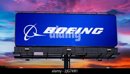 POZNAN, POL - JUN 28, 2022: Advertisement billboard displaying logo of The Boeing Company, an American multinational aerospace corporation Stock Photo