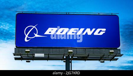 POZNAN, POL - JUN 28, 2022: Advertisement billboard displaying logo of The Boeing Company, an American multinational aerospace corporation Stock Photo