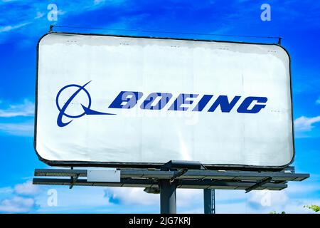 POZNAN, POL - JUN 28, 2022: Advertisement billboard displaying logo of The Boeing Company, an American multinational aerospace corporation Stock Photo