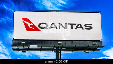 POZNAN, POL - JUN 28, 2022: Advertisement billboard displaying logo of Qantas Airways, the flag carrier of Australia Stock Photo