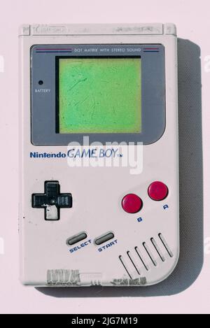 Game Boy is an 8-bit handheld game console developed and manufactured by Nintendo first released in 1989 Stock Photo