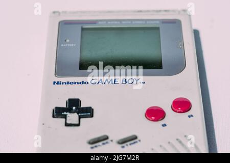 Game Boy is an 8-bit handheld game console developed and manufactured by Nintendo first released in 1989 Stock Photo