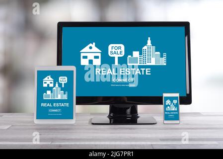 Real estate concept shown on different information technology devices Stock Photo