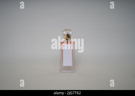 Orange Perfume bottle and cap for branding isolated on white background, Orange Perfume bottle mockup. Stock Photo