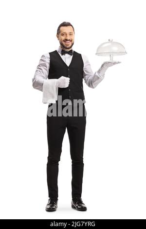 Smiling waiter holding an empty cake plate isolated on white background Stock Photo