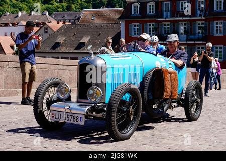 Heidelberg, Germany. 08th July, 2022. An Amilcar CGSS Kompressor from 1926, the oldest participating vehicle, drives over the Old Bridge as part of the 'ADAC Heidelberg Historic'. During this event, 180 classic cars will be touring the Odenwald, Kraichgau, Enzkreis and the northern district of Karlsruhe. Credit: Uwe Anspach/dpa/Alamy Live News Stock Photo