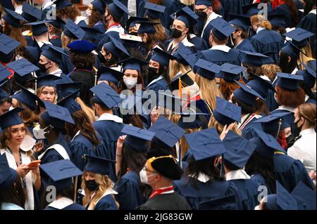 George Washington University college students in traditional robe and mortarboard on graduation day; Washington, D.C. Stock Photo