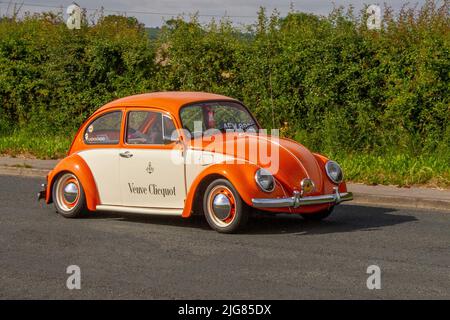 Advertising Veuve Clicquot 1972 70s seventies cream orange Old Type VW Volkswagen Beetle 1192cc petrol air-cooled vintage car. Bespoke vehicles en-route to Hoghton Tower for the Supercar Summer Showtime car meet which is organised by Great British Motor Shows in Preston, UK Stock Photo