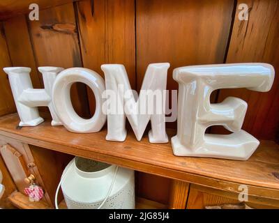 Home Letters Decor on White Shelf Stock Photo - Image of