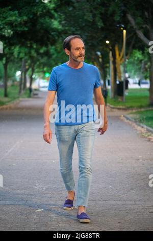 Full-length outdoor portrait of mature adult man. Stock Photo