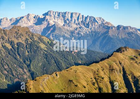 Italy, Veneto, Belluno, Canale d'Agordo, morning view of the green ridge of Palalada, on the background the siuth side of Marmolada Stock Photo