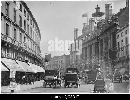 Regent Street, City of Westminster, Greater London Authority, 1911. A busy scene looking east along Regent Street, showing the facade of the Piccadilly Hotel, with pedestrians and traffic in the foreground. The Piccadilly Hotel, designed by the architect Richard Norman Shaw, was built in 1905-8, shortly before this photograph was taken. Stock Photo