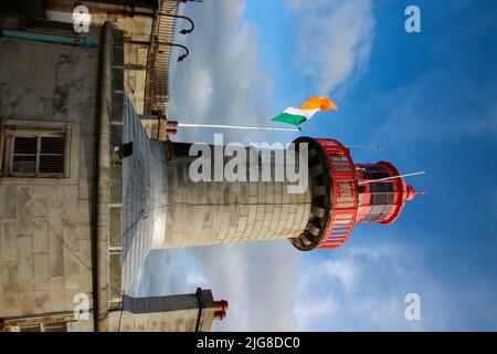 View of lighthouse, dock, pier, flag, Dun Laoghaire, County Dublin, Ireland Stock Photo