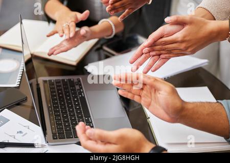 Appreciating the effort you put in. Shot of a team of business people applauding during a meeting. Stock Photo