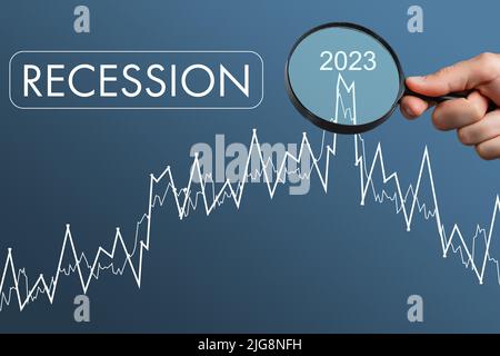 Economic crisis, Businessman using mobile smartphone analyzing sales data and economic graph chart that is falling, stock market crash caused. Stock Photo