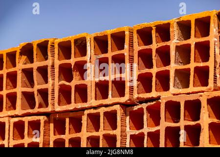 Goiania, Goiás, Brazil – July 08, 2022:  Ceramic bricks arranged in piles and stored outdoors for sale. Stock Photo