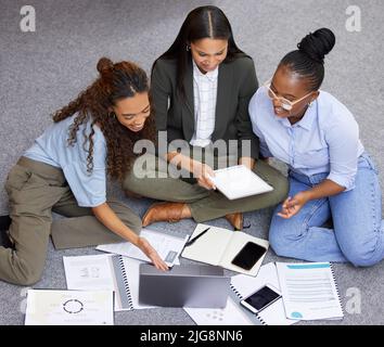 Putting our brilliant minds together. Shot of a team of businesswomen working together during a meeting. Stock Photo