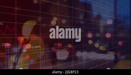 Image of blurred traffic lights over graphs and dark space Stock Photo