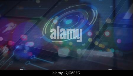 Image of blurred traffic lights over processing circle and dark space Stock Photo